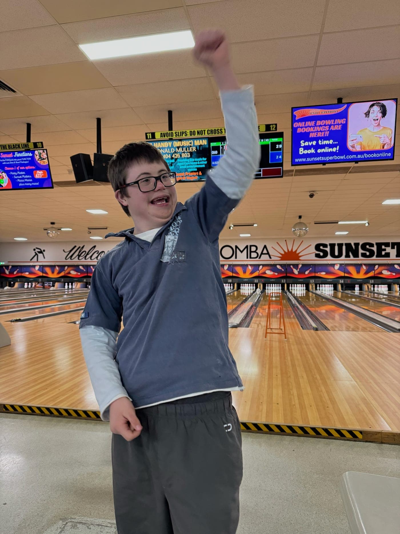 A participant celebrating at ten-pin bowling