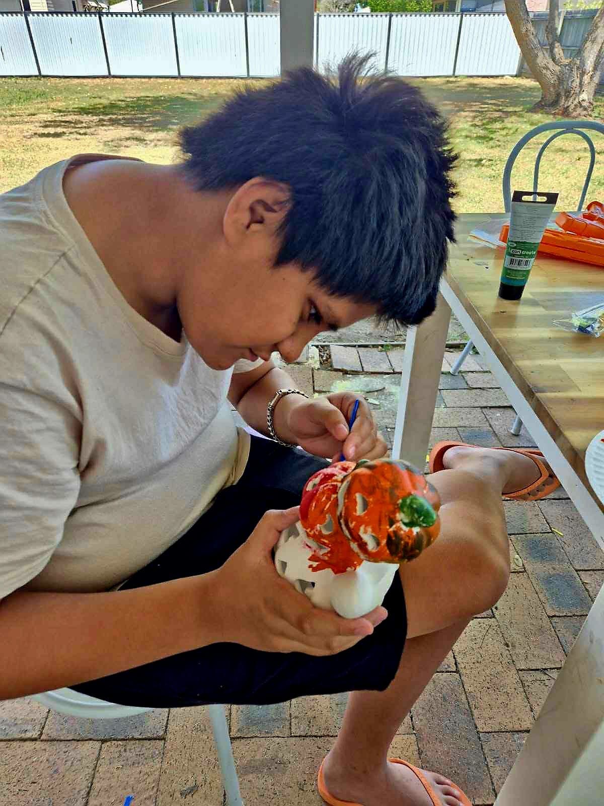 A participant concentrating on a craft activity
